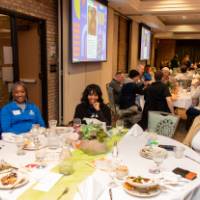 six people at luncheon table